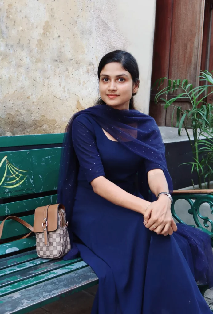 Vintage-style portrait of a girl sitting at Jew Street, Fort Kochi. Portrait from Kochi photography portfolio.